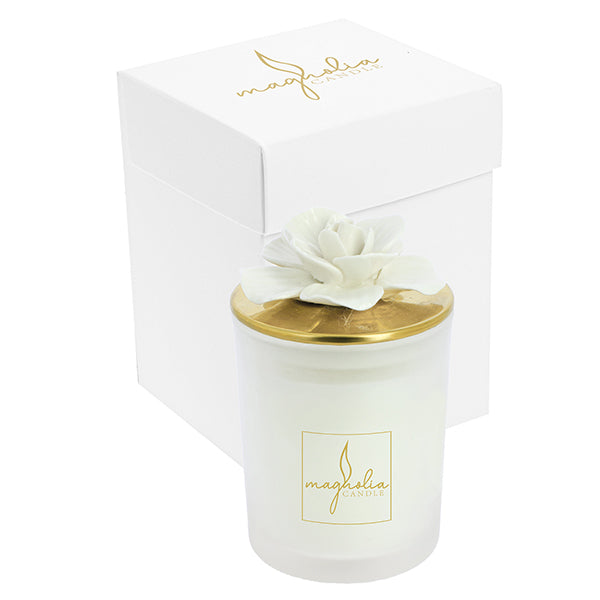 Bomboniera Magnolia candle con tappo oro e magnolia bianca