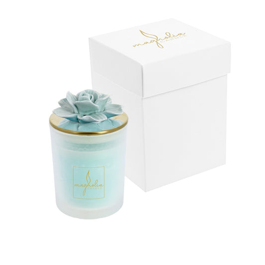 Bomboniera Magnolia candle con tappo oro e magnolia acqua marina