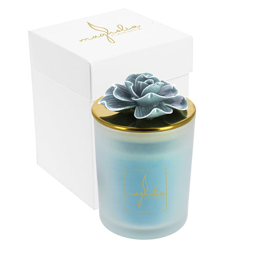 Bomboniera Magnolia candle con tappo oro e magnolia carta da zucchero