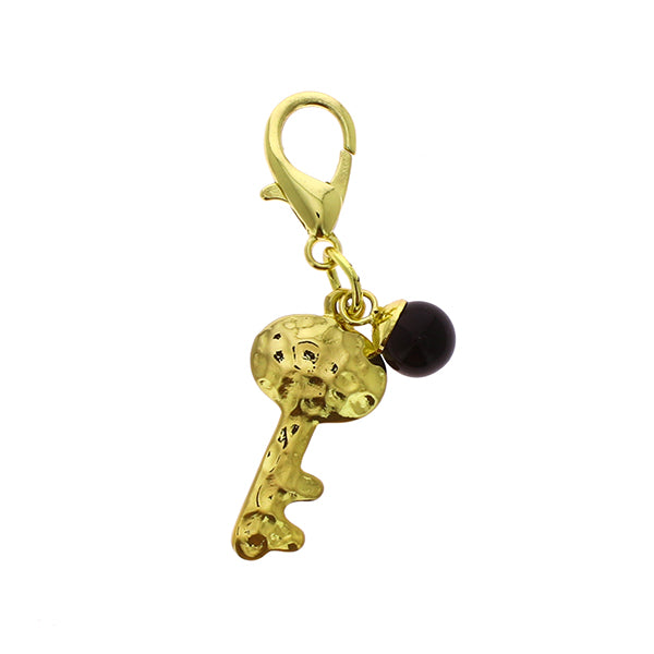 Accessorio ciondolo chiave oro martellato con pendente nero